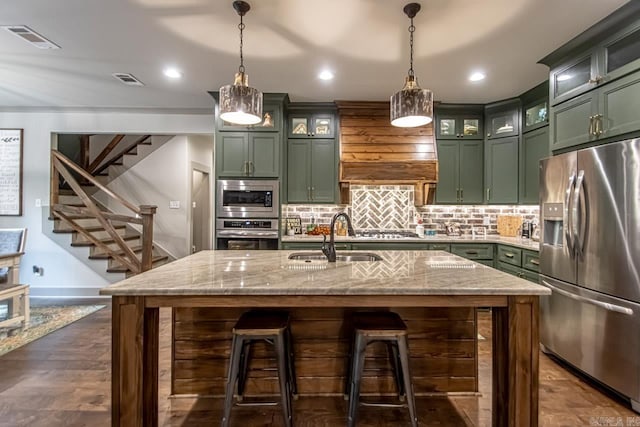 4201 Lovell Ln, Benton, AR 72019 - kitchen featuring a sink, appliances with stainless steel finishes, green cabinets, and light stone countertops