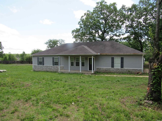 3801 W Maddox, Jacksonville, AR 72076 - ranch-style house featuring a front yard, covered porch, and stone siding
