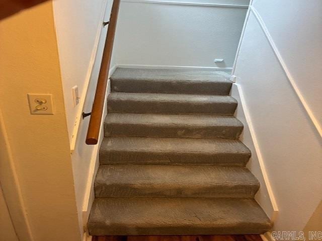 stairs with wood finished floors