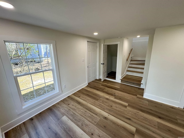 209 Goshen Ave, North Little Rock, AR 72116 - unfurnished room featuring stairs, recessed lighting, baseboards, and wood finished floors