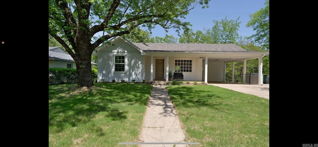 209 Goshen Ave, North Little Rock, AR 72116 - view of front of home featuring a carport, concrete driveway, and a front yard