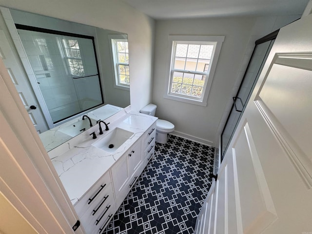 209 Goshen Ave, North Little Rock, AR 72116 - full bathroom featuring baseboards, toilet, and vanity