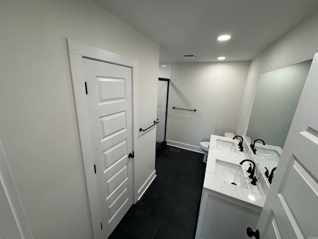 209 Goshen Ave, North Little Rock, AR 72116 - full bath featuring double vanity, a sink, recessed lighting, and toilet