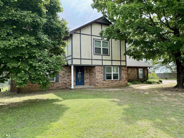 7 Franklin Cir, Searcy, AR 72143 - tudor house featuring brick siding and a front yard