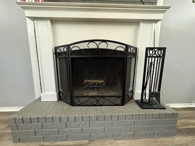 7 Franklin Cir, Searcy, AR 72143 - interior details with baseboards, wood finished floors, and a fireplace