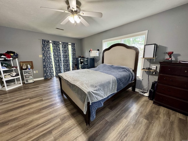 7 Franklin Cir, Searcy, AR 72143 - bedroom featuring baseboards, a ceiling fan, wood finished floors, and visible vents