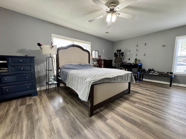 7 Franklin Cir, Searcy, AR 72143 - bedroom featuring a ceiling fan, baseboards, and dark wood finished floors