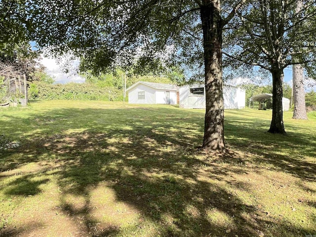 view of yard with a carport
