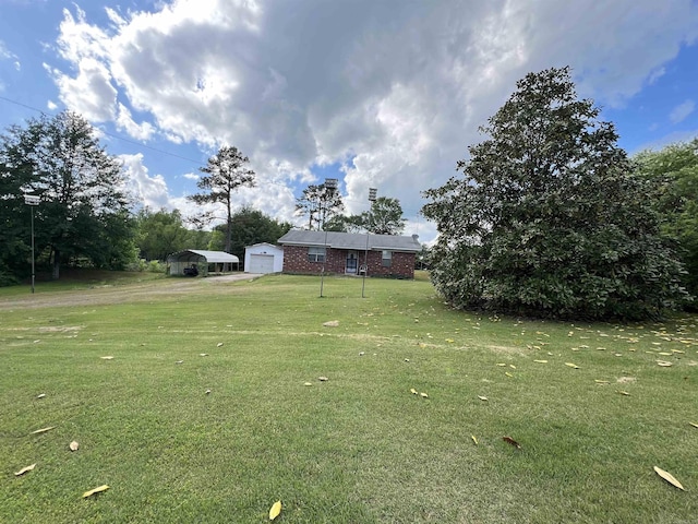 view of yard featuring a detached carport