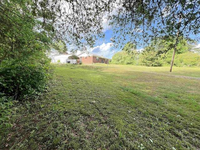 view of yard with a detached carport