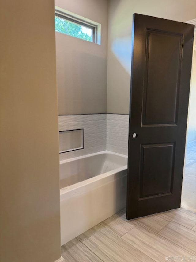 bathroom featuring a bath