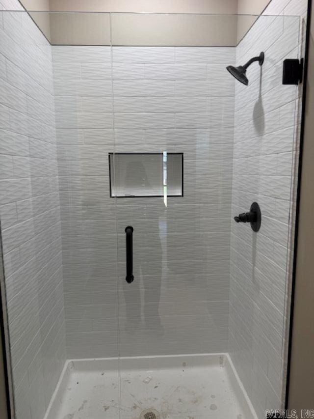 full bathroom with a shower stall