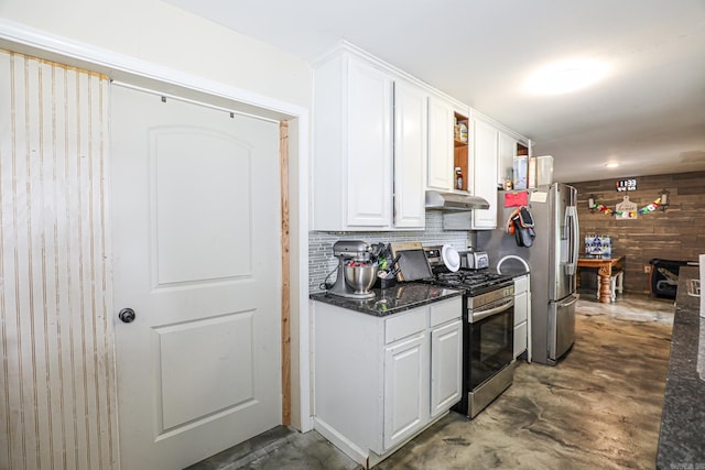 kitchen with white cabinetry, appliances with stainless steel finishes, under cabinet range hood, and concrete flooring