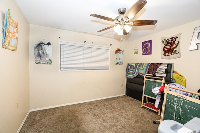 bedroom with baseboards, ceiling fan, and carpet