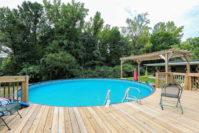 pool with a wooden deck and a pergola
