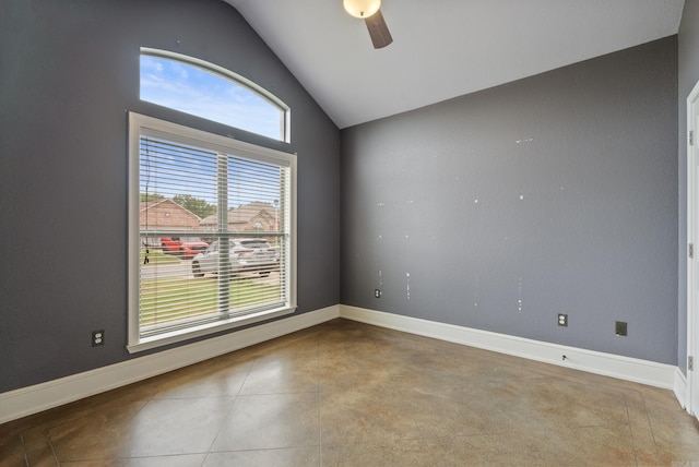 spare room featuring baseboards, a ceiling fan, and lofted ceiling