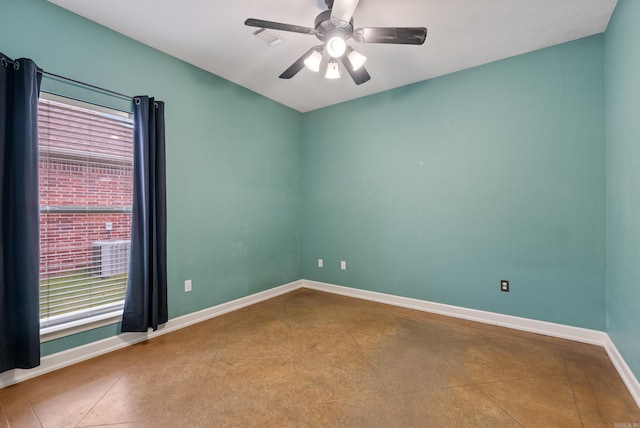 unfurnished room with a ceiling fan, baseboards, and tile patterned flooring