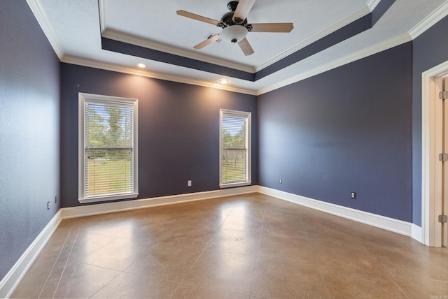 unfurnished room with crown molding, a raised ceiling, baseboards, and a ceiling fan