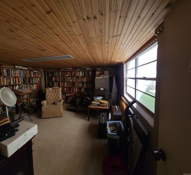 110 S Summit St, Little Rock, AR 72205 - sitting room with carpet flooring, wall of books, and wooden ceiling