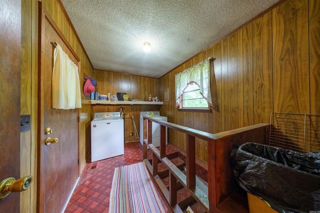 3009 N Main St, Mount Pleasant, AR 72651 - interior space with laundry area, a textured ceiling, independent washer and dryer, brick patterned floor, and wooden walls