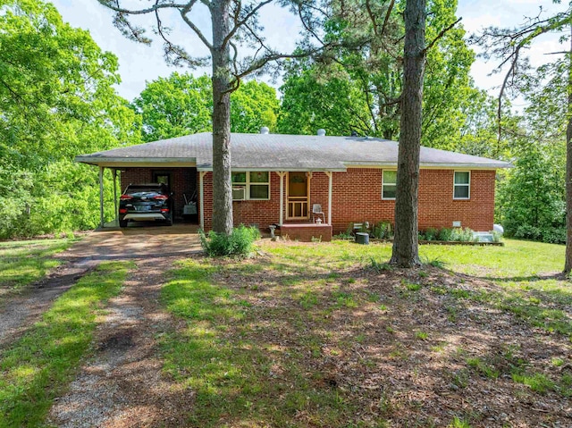 3009 N Main St, Mount Pleasant, AR 72651 - ranch-style house with a carport, driveway, and brick siding