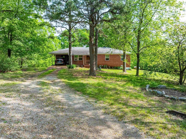 3009 N Main St, Mount Pleasant, AR 72651 - ranch-style home with an attached carport, brick siding, a front lawn, and dirt driveway