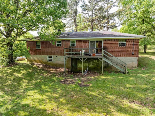3009 N Main St, Mount Pleasant, AR 72651 - rear view of house featuring a lawn, stairs, a wooden deck, and brick siding
