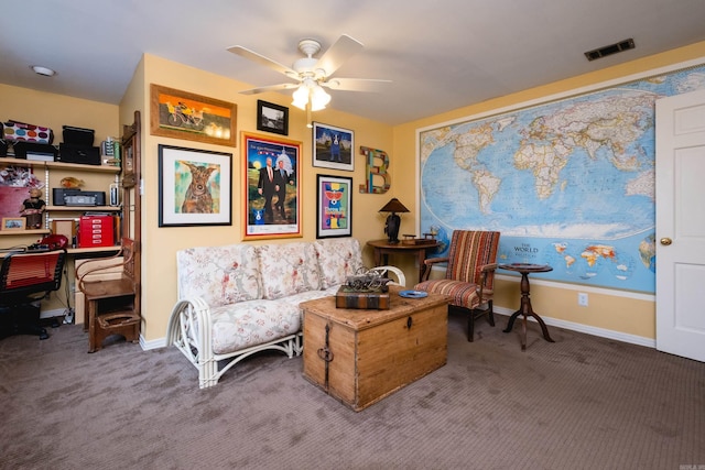 living area featuring carpet floors, a ceiling fan, baseboards, and visible vents