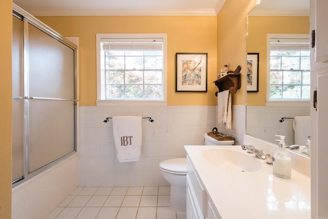 full bath featuring crown molding, tile walls, tile patterned flooring, vanity, and toilet