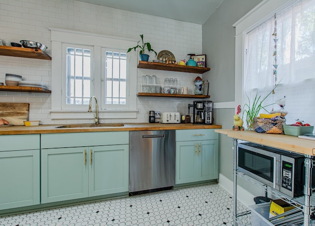 316 W 22nd, Little Rock, AR 72206 - kitchen with open shelves, a sink, green cabinets, wood counters, and stainless steel appliances