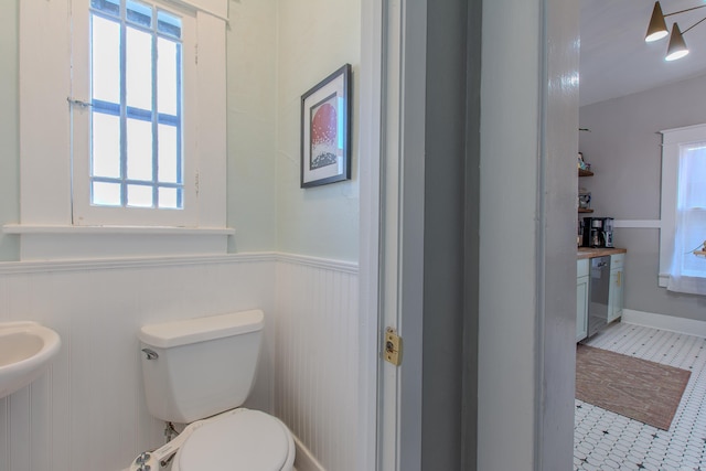 316 W 22nd, Little Rock, AR 72206 - half bath with a healthy amount of sunlight, wainscoting, and toilet