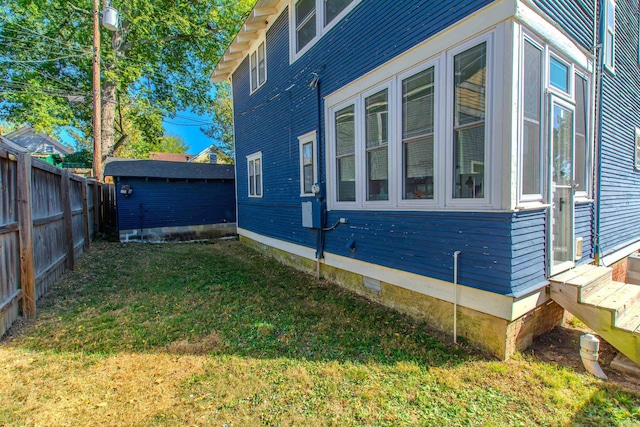 316 W 22nd, Little Rock, AR 72206 - view of property exterior with fence, a yard, entry steps, and crawl space
