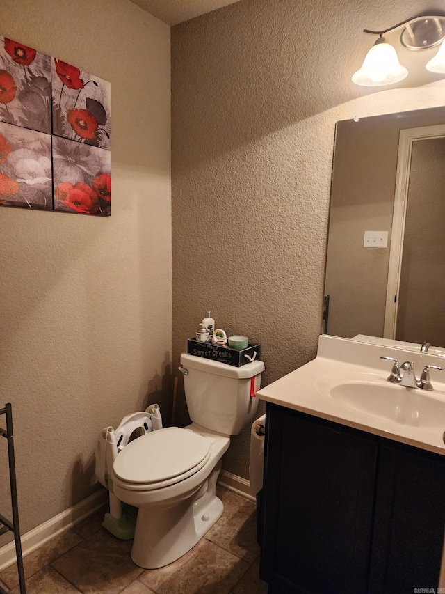 half bath with tile patterned flooring, a textured wall, and toilet