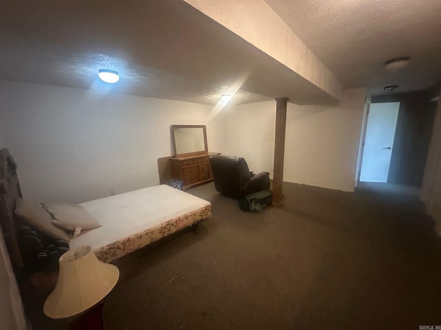 carpeted bedroom featuring a textured ceiling