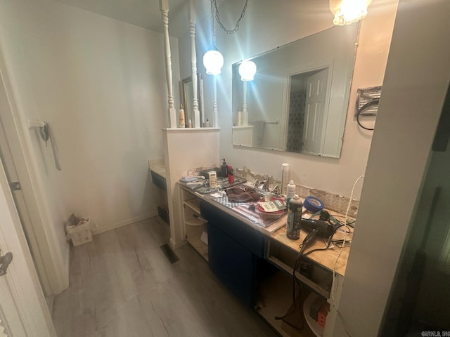 bathroom featuring wood finished floors and vanity