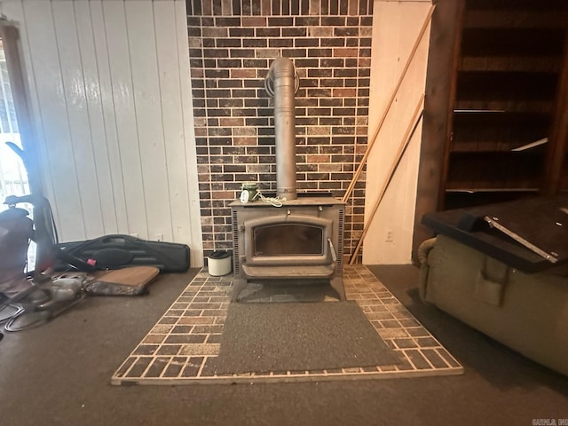 room details with a wood stove and wood walls