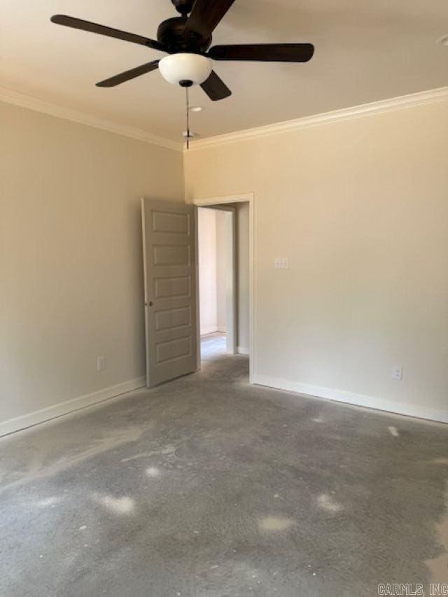 empty room featuring crown molding, a ceiling fan, baseboards, and concrete flooring