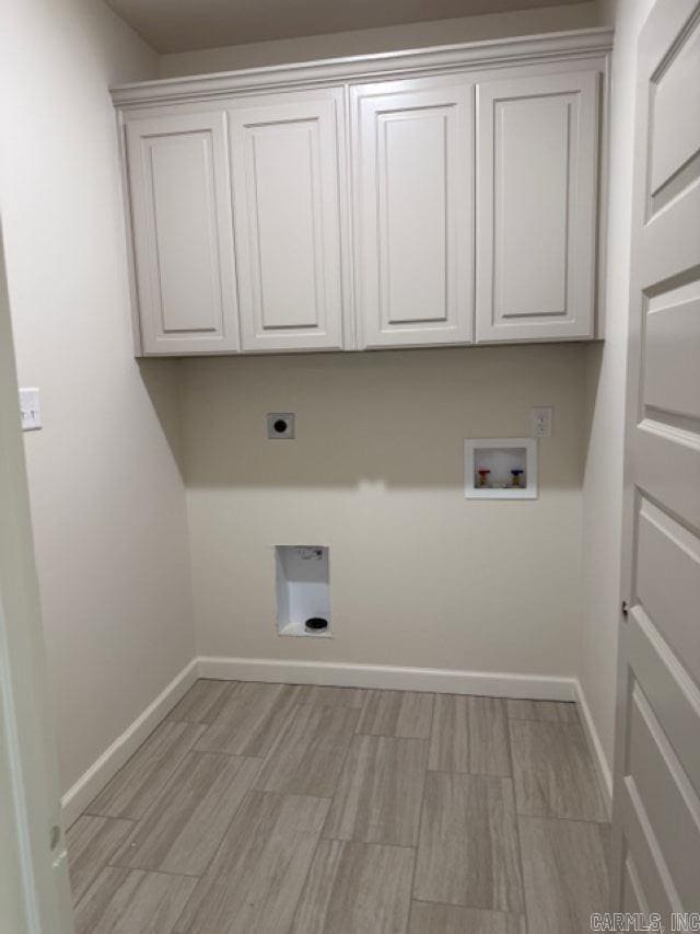 218 Heather Loop, Beebe, AR 72012 - washroom with cabinet space, light wood finished floors, hookup for a washing machine, baseboards, and hookup for an electric dryer