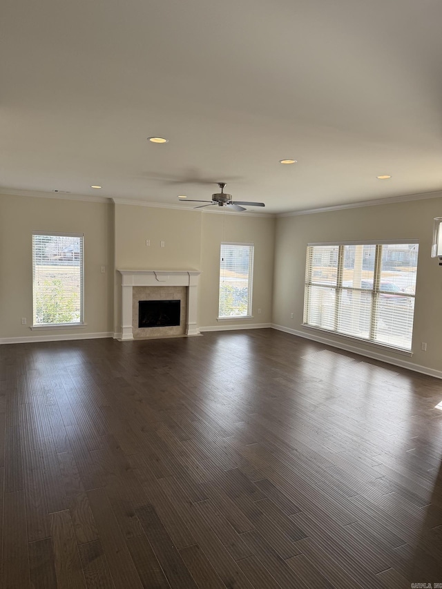 unfurnished living room with crown molding, recessed lighting, and a wealth of natural light