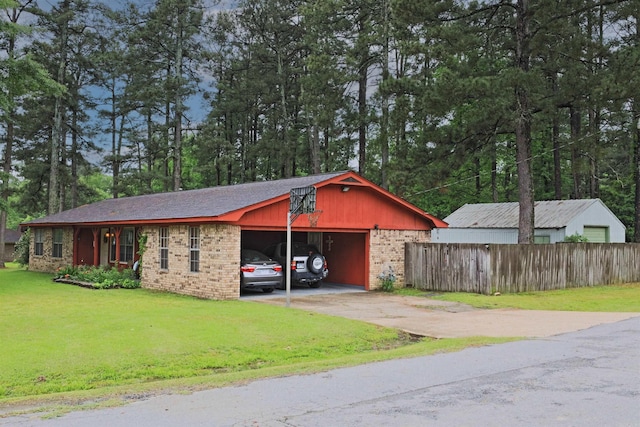exterior space with fence and concrete driveway