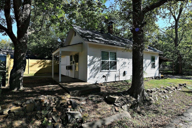 view of property exterior with a chimney