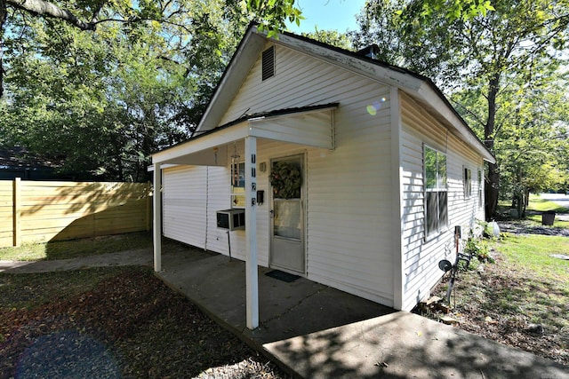 view of outdoor structure featuring fence