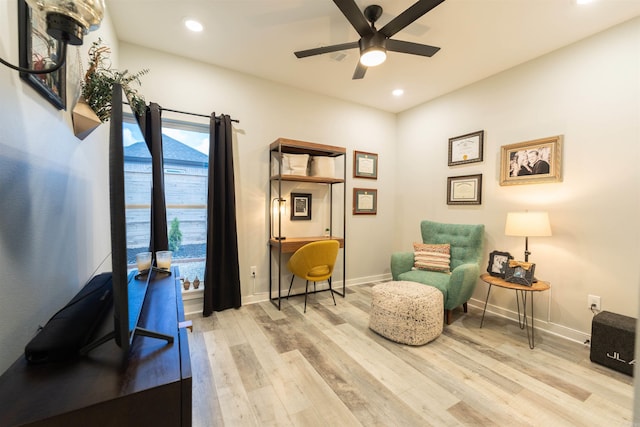 living area with recessed lighting, a ceiling fan, baseboards, and wood finished floors