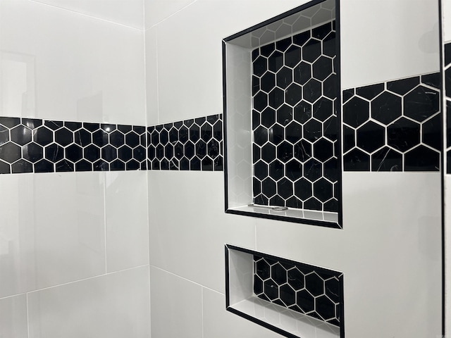 interior space with tiled shower
