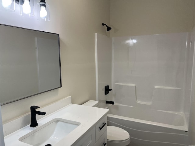 full bath featuring vanity, toilet, and shower / washtub combination