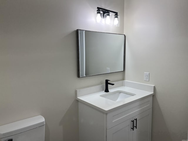 half bath with vanity and toilet