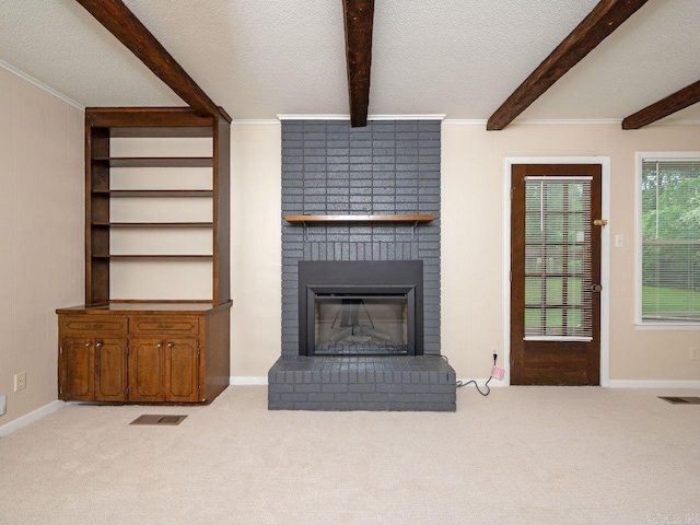 living room with a textured ceiling, visible vents, and beam ceiling