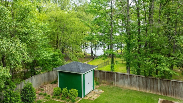 view of shed featuring a fenced backyard