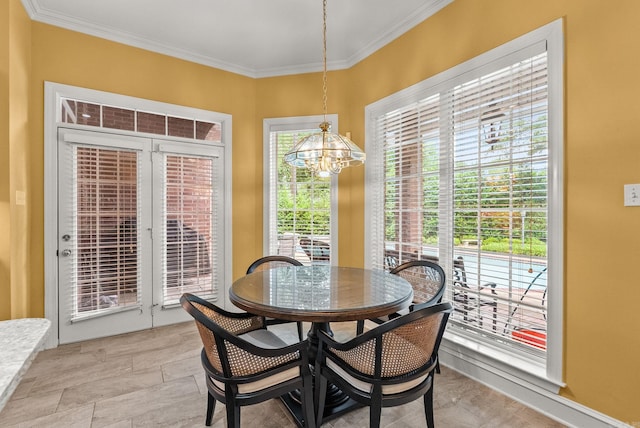 dining space with a notable chandelier and ornamental molding