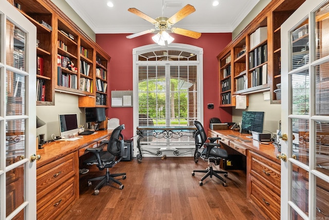 office area with built in desk, a ceiling fan, recessed lighting, dark wood-type flooring, and ornamental molding